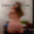Blindfolded woman swinger party