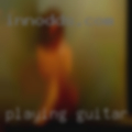 Playing guitar woman